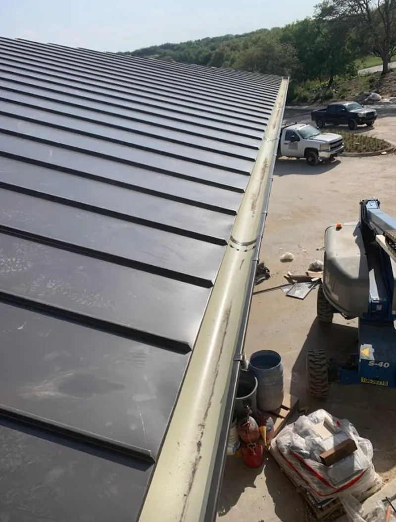 Standing seam panel and gutter detail on a metal roofing jobsite in Cinnaminson